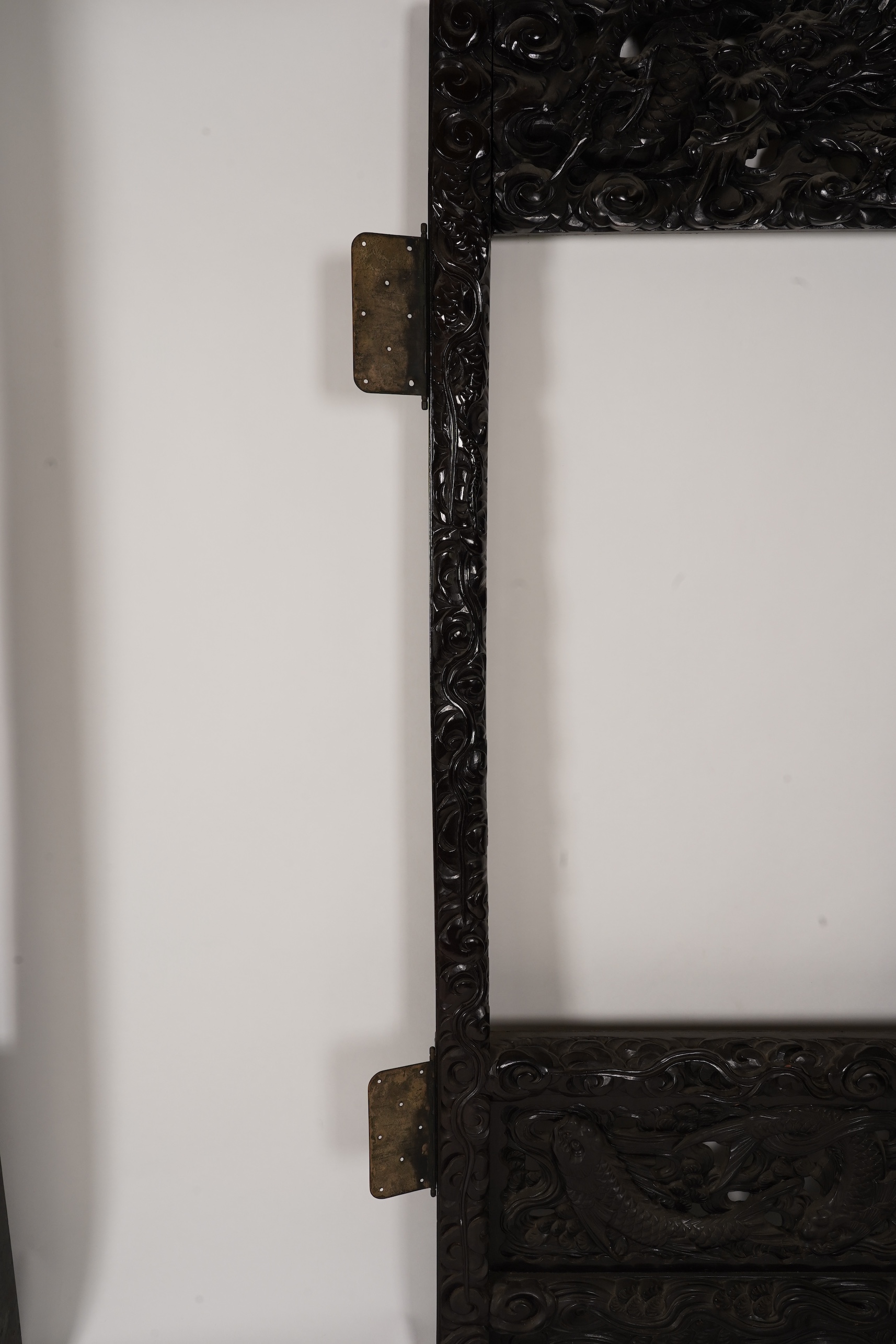 A pair of large Japanese carved hardwood ’dragon’ screen frames, Meiji period